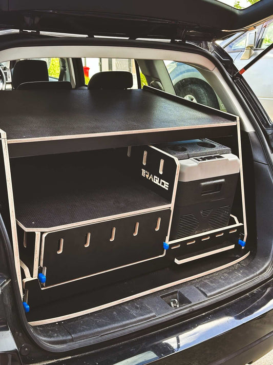 Teraglide compact kitchen module set up in the trunk of a vehicle, showcasing organized storage and cooking surface.