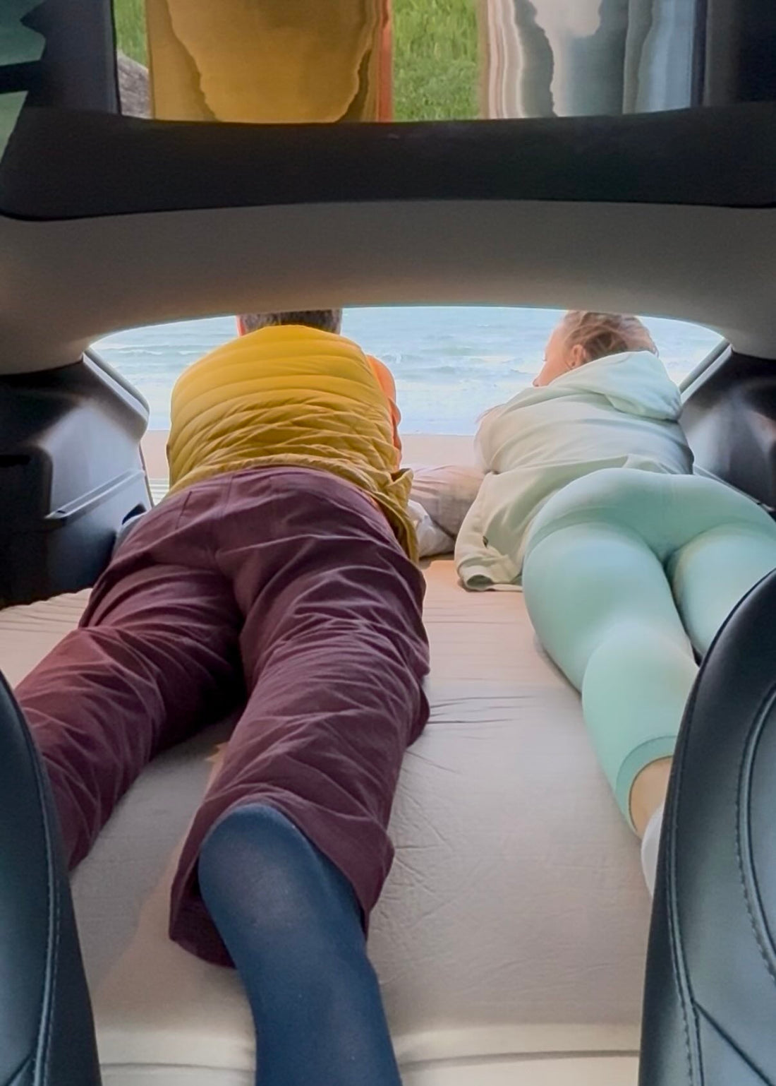 Teraglide platform bed set up inside SUV trunk, showing full-length flat sleeping surface for car camping comfort.