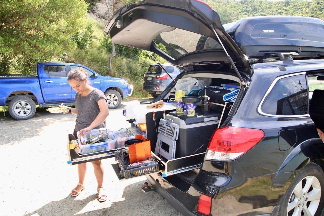 Teraglide kitchen in Subaru trunk, showcasing organized storage and convenient cooking setup for camping.