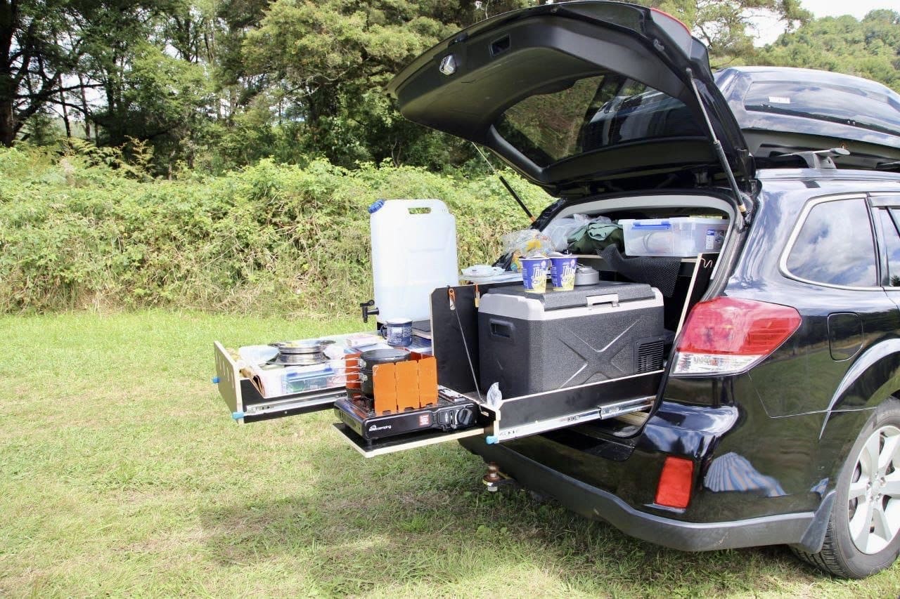 Teraglide kitchen module set up at the back of the car — organized drawers and cooking space for car camping trips.