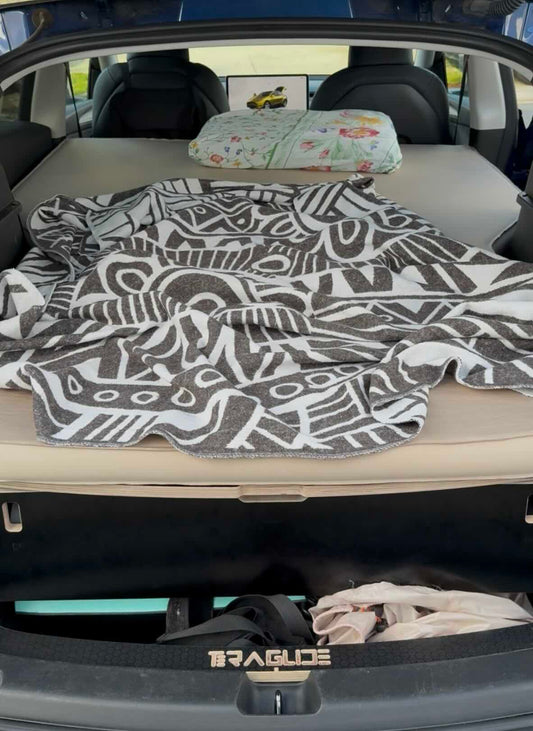Car camping bed platform fully set up and ready for sleeping