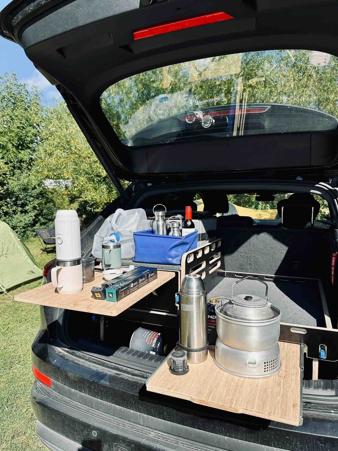 Teraglide sleeping platform installed in a couple’s SUV ready for a weekend camping trip