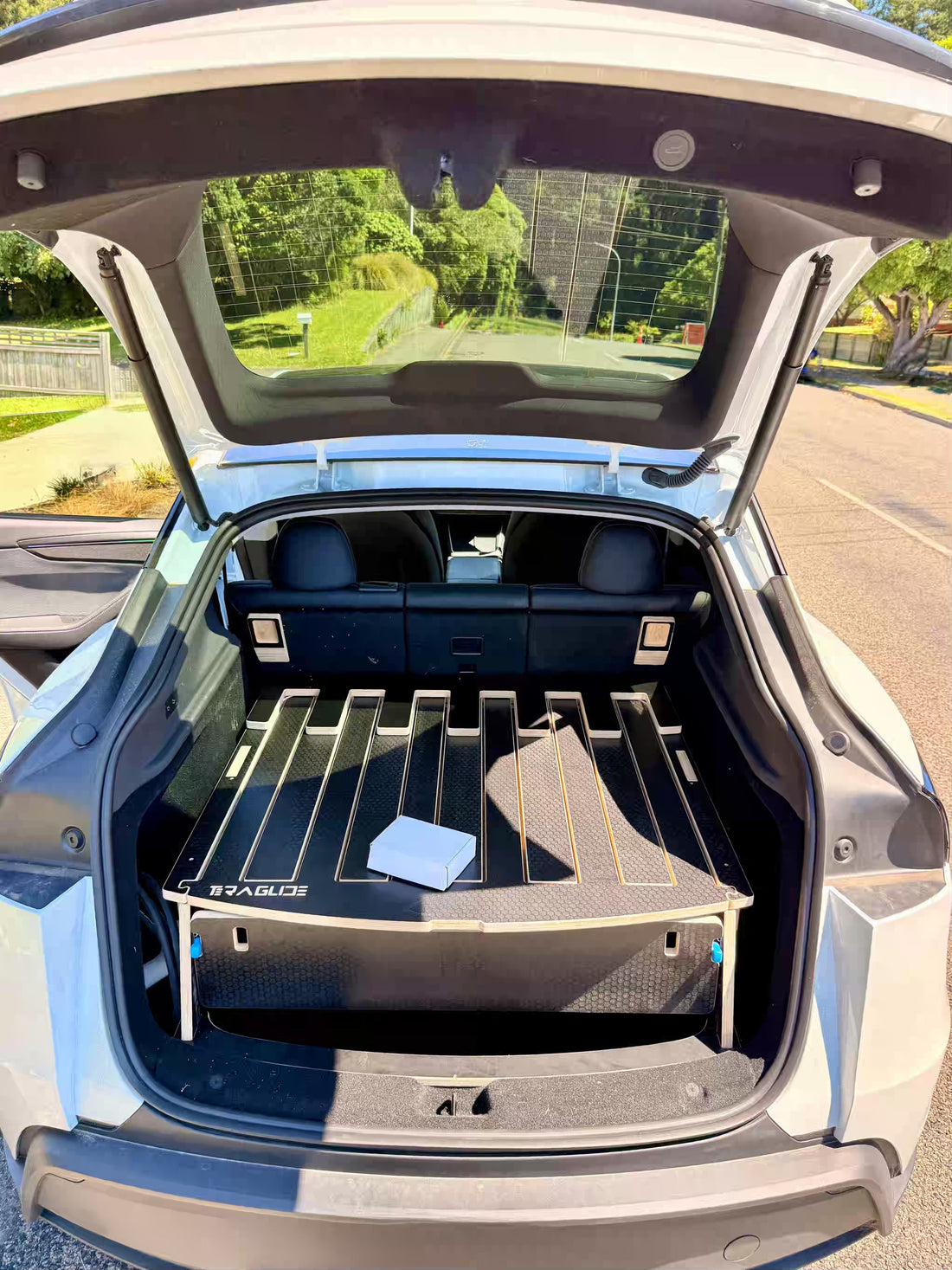 Teraglide camping platform folded inside the trunk of a Tesla Model Y Juniper for everyday use