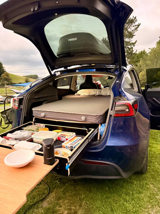 Flat Teraglide camping platform set up in a Tesla Y for more comfortable sleep without seat gap or rear-seat slope