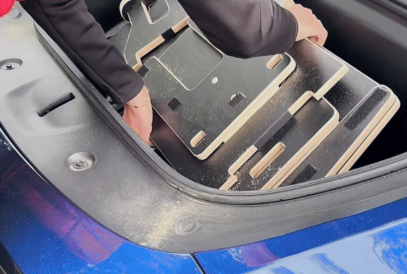 Setting up Teraglide CAB over front seats – a compact, Velcro-secured sleeping surface for kids.