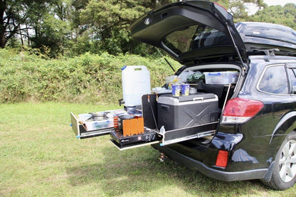 Teraglide kitchen module set up at the back of the car — organized drawers and cooking space for car camping trips.