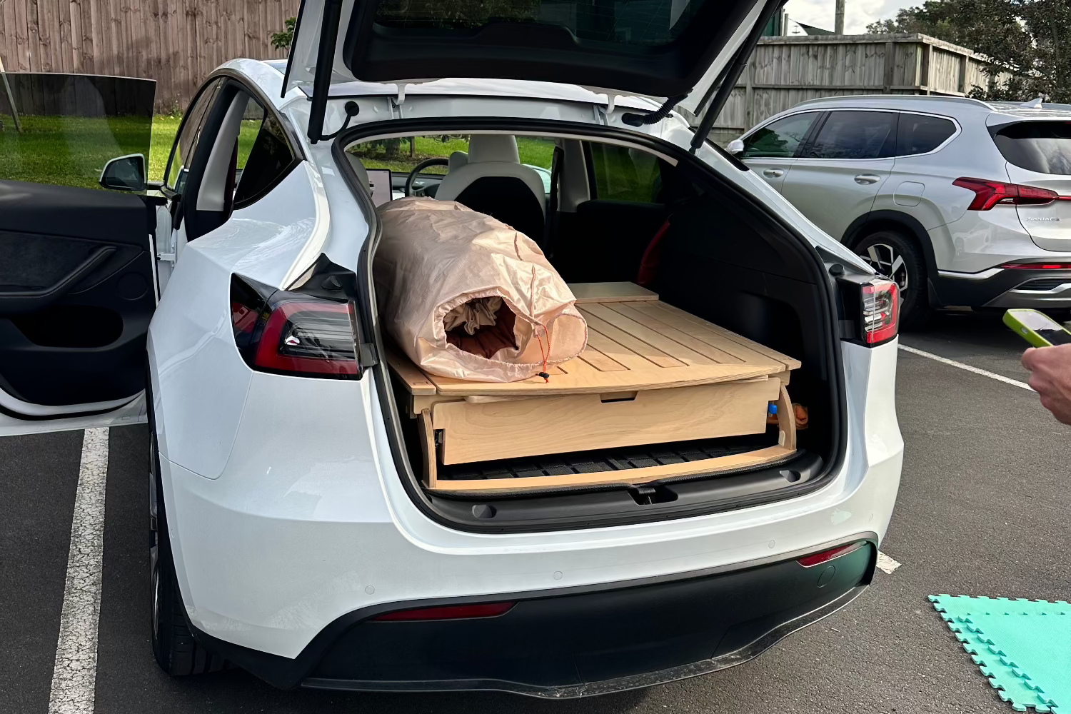 Crafted from premium birch for a sleek, durable finish. Quick setup, secure storage, and a comfortable sleeping surface—perfect for SUVs, minivans, and Teslas. Built sustainably for hassle-free adventures.