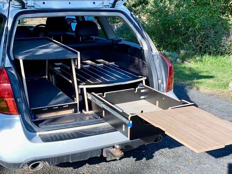 Foldable car camping platform for SUVs — organized storage and flat sleeping surface by Teraglide
