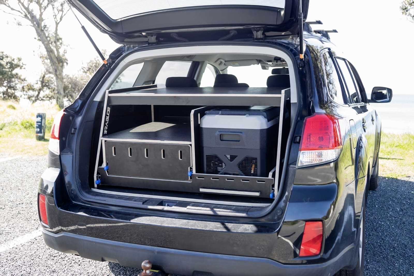 Slide-out kitchen box for SUV trunk — lockable drawers, cooking surface, compact storage by Teraglide
