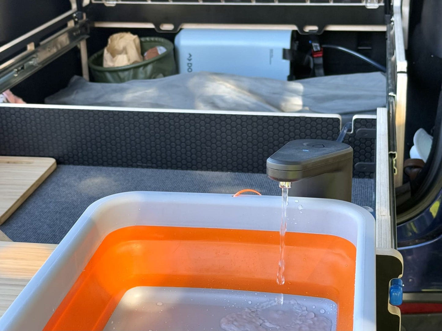 Teraglide PRO camping setup with Dometic water jug and sink