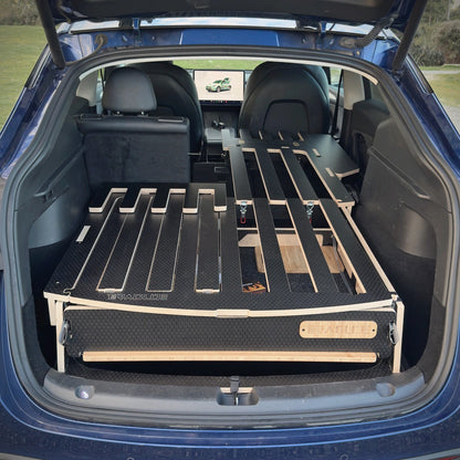 Teraglide PRO deck extending over the folded rear seats of a Tesla Model Y