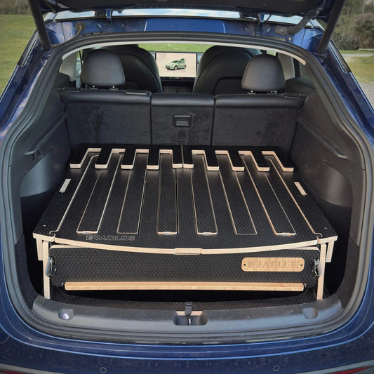 Interior view of the Teraglide PRO platform stowed in a Tesla Model Y with the rear seats upright