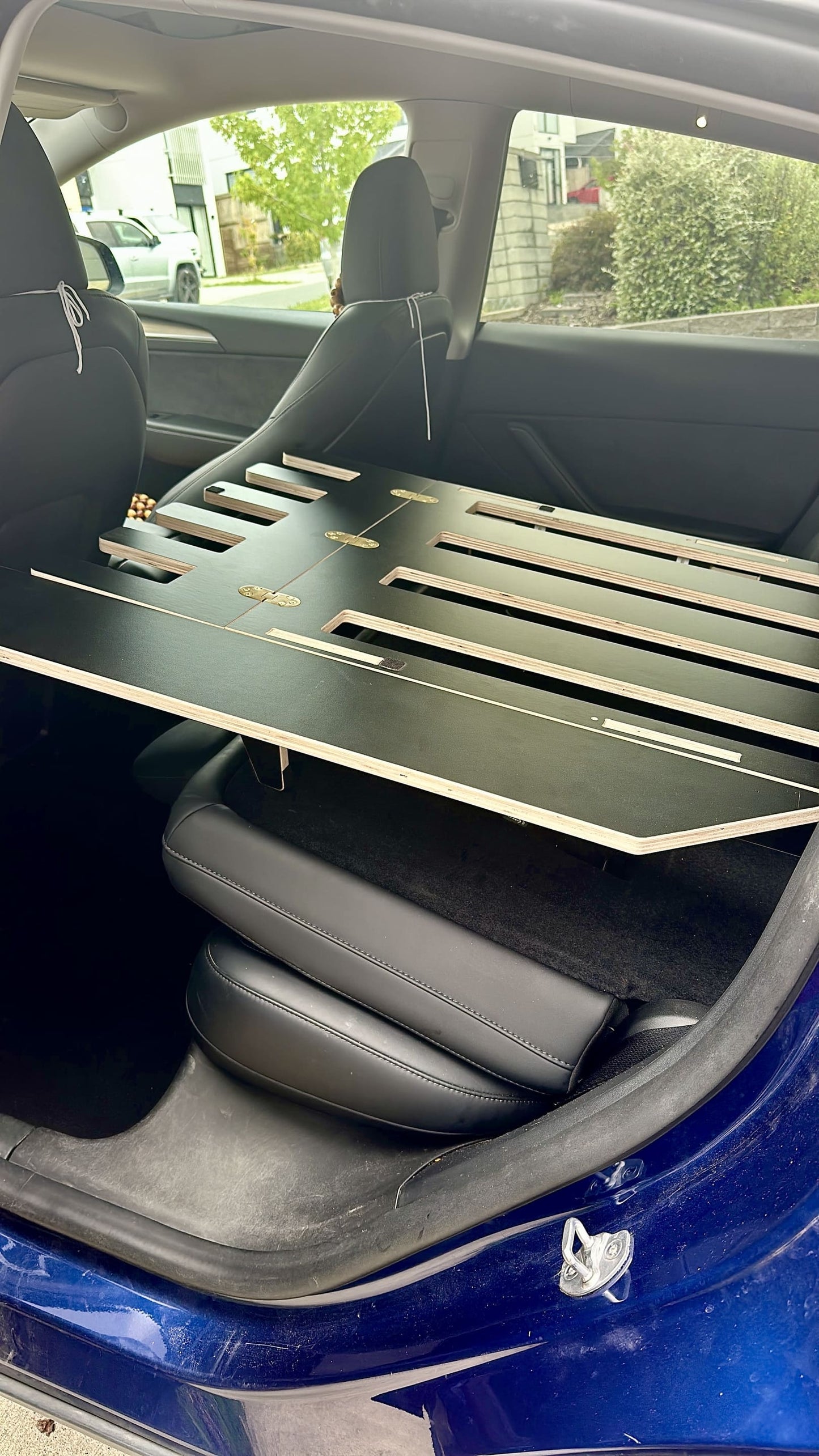 Teraglide SOLO car camping platform — 60/40 split bed and storage for solo travellers in SUVs or EVs