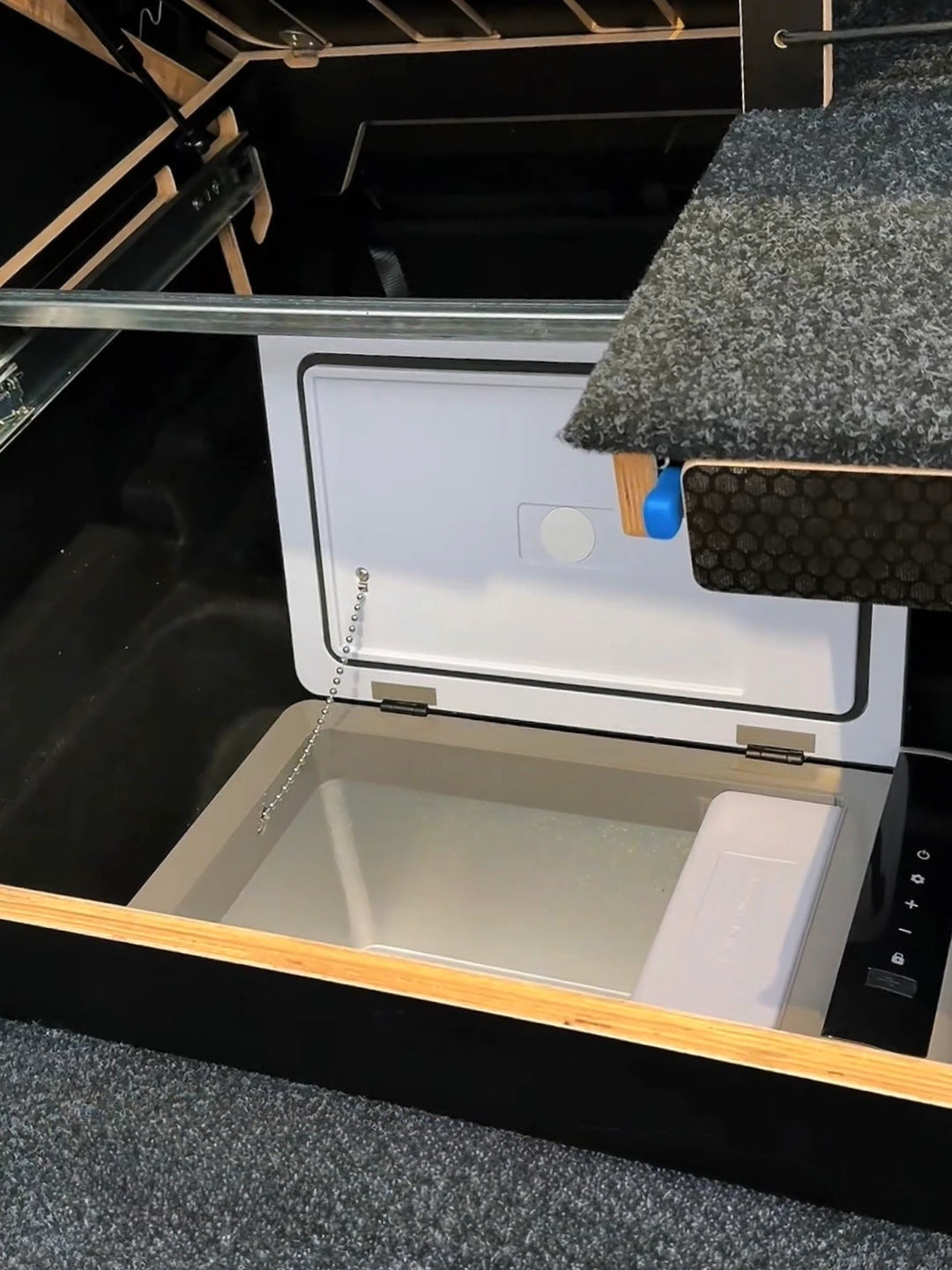 Access to a portable fridge in the Tesla Model Y subtrunk without removing the Teraglide SOLO camping platform.